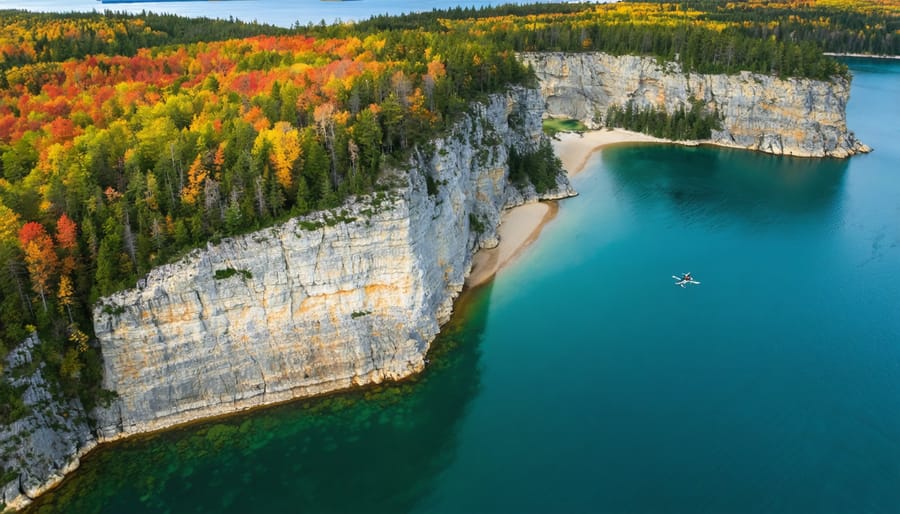 Drone capturing diverse Ontario landscapes; vibrant autumn colors of Algonquin Park, rugged cliffs of Scarborough Bluffs, and clear turquoise waters of Tobermory.