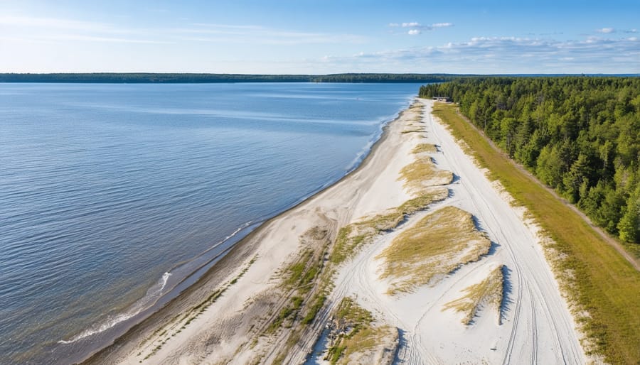 Aerial photograph of Wasaga Beach's pristine shoreline with swimmers enjoying the natural water park