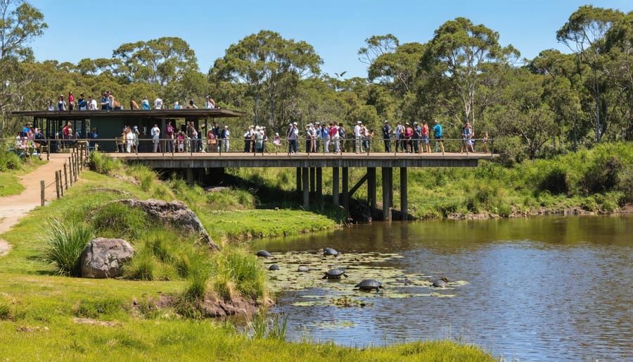 Visitors on wooden observation deck watching wildlife at Toronto Zoo's nature trail