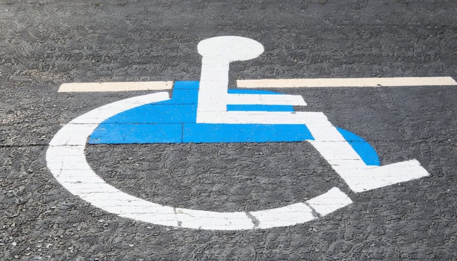 Accessible parking space with clear markings and adjacent wheelchair-accessible trail entrance