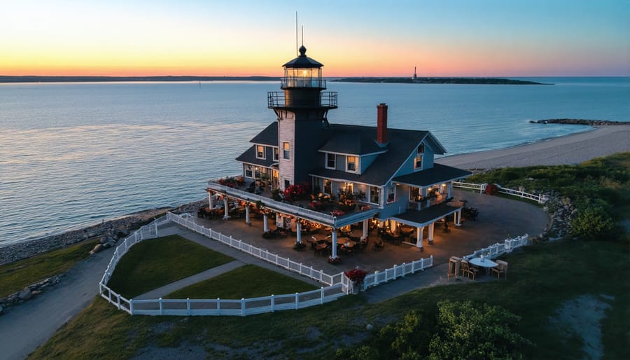 Scenic waterfront view of the Lighthouse Restaurant with outdoor dining area and Lake Ontario's waves