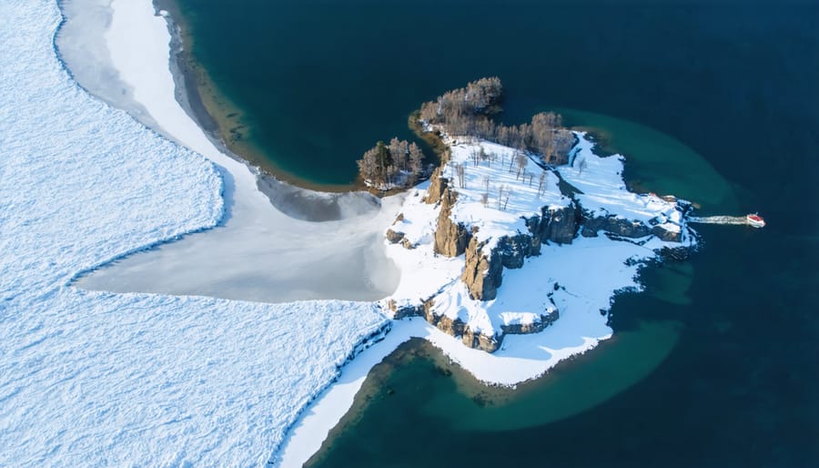Snow-covered Sleeping Giant peninsula formation rising above frozen Lake Superior