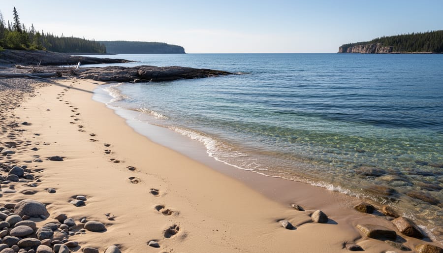 Hikers on the shoreline at Middlebrun Bay with Lake Superior in the background