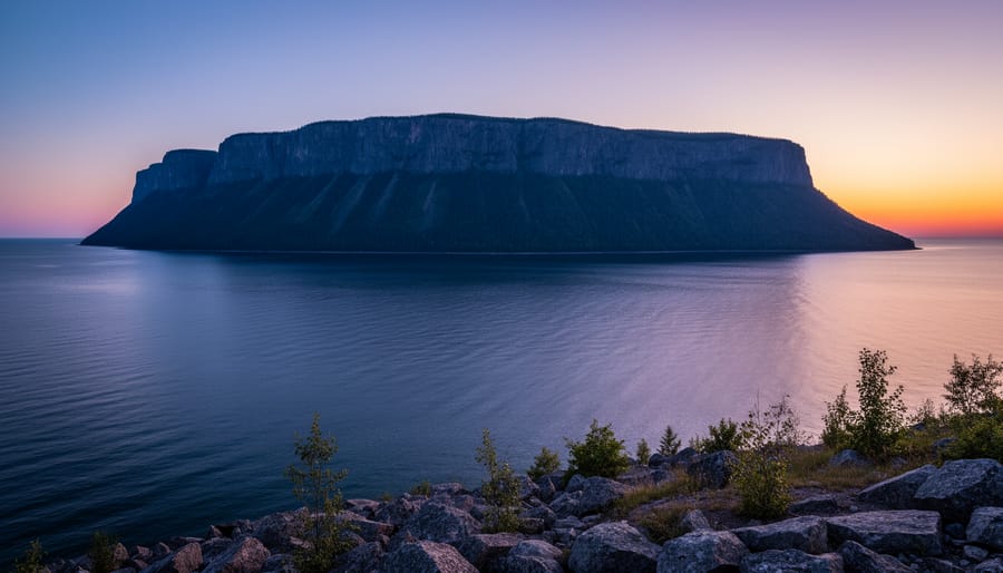 Dusk view of Sleeping Giant Provincial Park cliffs rising above Lake Superior